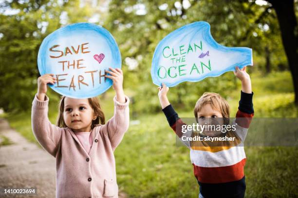 save our childhood by saving the environment! - climate action stock pictures, royalty-free photos & images