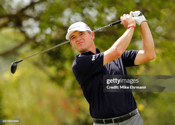 Paul Lawrie of Scotland hits his tee shot on the fifth hole during the second round of the 2012 World Golf Championships Cadillac Championship at...