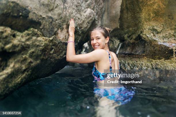 teenage girl hiking in river in valencia, spain - wading river stock pictures, royalty-free photos & images