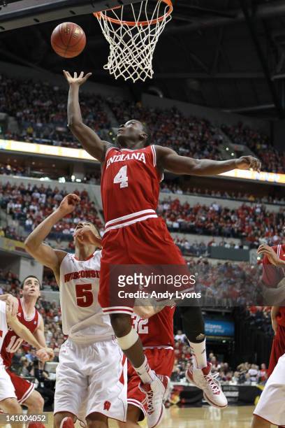 Victor Oladipo of the Indiana Hoosiers reaches for a rebound against Ryan Evans of the Wisconsin Badgers during their quarterfinal game of 2012 Big...