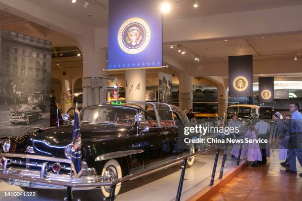 People watch a convertible car used to be ridden by former U.S. President Dwight David Eisenhower at Henry Ford Museum on July 20, 2022 in Detroit,...