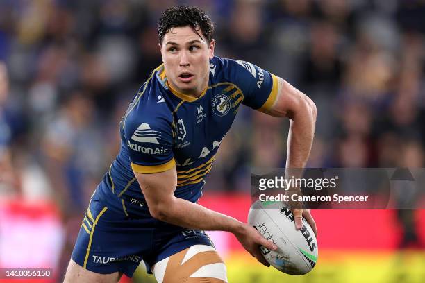 Mitchell Moses of the Eels offloads the ball during the round 19 NRL match between the Parramatta Eels and the Brisbane Broncos at CommBank Stadium...