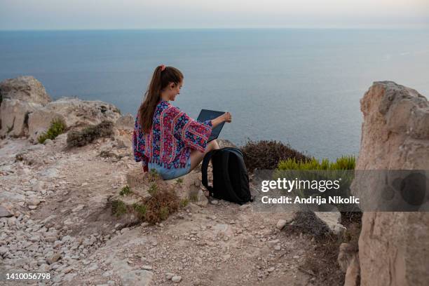 young woman enjoying beautiful view while working remotely - malta business stock pictures, royalty-free photos & images
