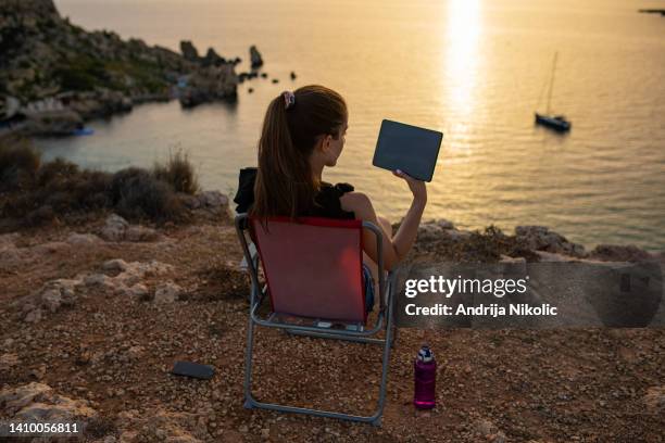 young woman enjoying beautiful view while working remotely - malta business stock pictures, royalty-free photos & images