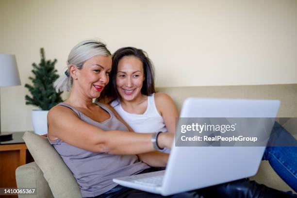 it's time for online shopping - gay couple in love stock pictures, royalty-free photos & images