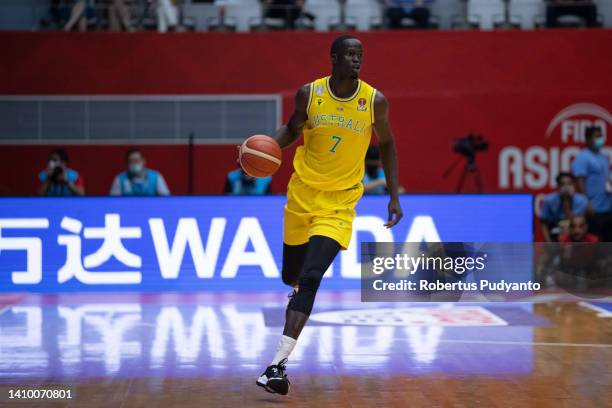 Thon Maker of Australia dribbles the ball during the FIBA Asia Cup quarter-final between Australia and Japan at Istora Gelora Bung Karno on July 21,...