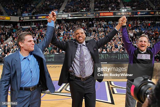 Sacramento mayor Kevin Johnson and owners Joe Maloof and Gavin Maloof of the Sacramento Kings holding up their hands before the game between the Utah...