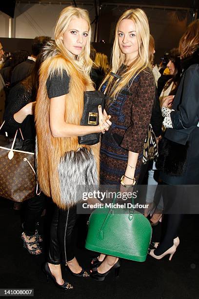 Poppy Delevingne and Virginie Courtin attend the Louis Vuitton Ready-To-Wear Fall/Winter 2012 show as part of Paris Fashion Week on March 7, 2012 in...