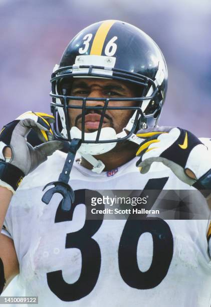 Jerome Bettis, Running Back for the Pittsburgh Steelers adjusts his helmet strap during the American Football Conference Central Division game...