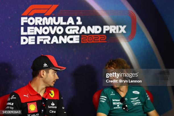 Charles Leclerc of Monaco and Ferrari and Sebastian Vettel of Germany and Aston Martin F1 Team talk in the Drivers Press Conference during previews...