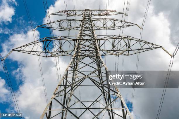 the power pole high-voltage lines - electricity pylon stock pictures, royalty-free photos & images