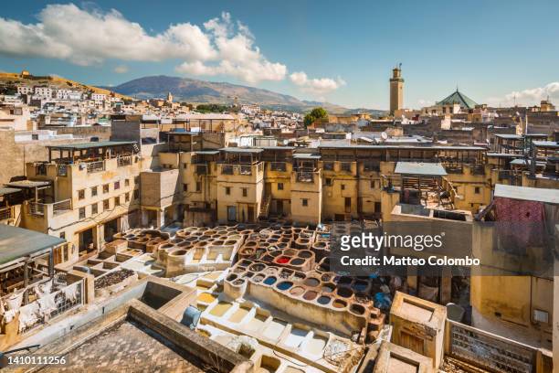 old tannery and city, fes, morocco - medina district stock pictures, royalty-free photos & images