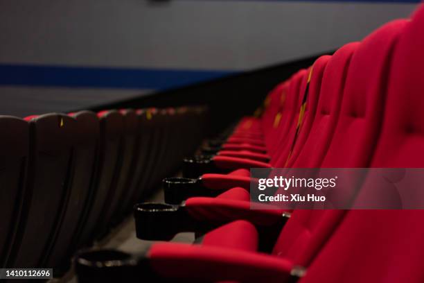 red seats at the cinema - film premiere stockfoto's en -beelden