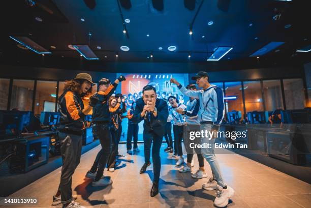 asian emcee game show host introducing grand final esports team players on stage - awards ceremony sports stock pictures, royalty-free photos & images
