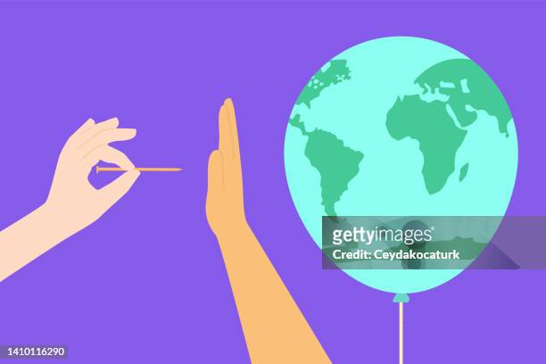 hand protecting balloon world from needle. save the world concepts. - sewing needle stock illustrations