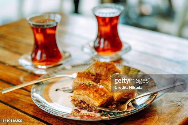 delicious turkish baklava and tea - baklava stock pictures, royalty-free photos & images