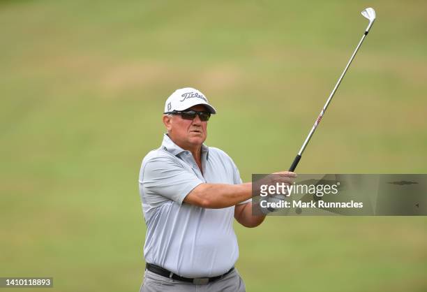 Peter O'Malley of Australia plays his second shot at the 2nd hole during Day One of The Senior Open Presented by Rolex at The King's Course at...