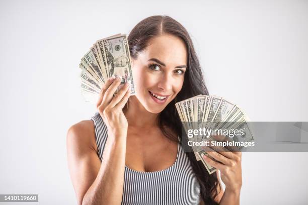 cheerful beautiful woman with american bills in both hands. - slovakia money stock pictures, royalty-free photos & images