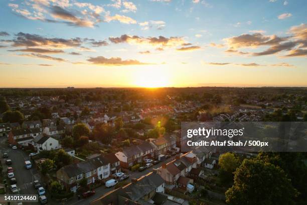 best aerial cityscape view of england at golden hour sunset time with colourful clouds on sky,luton,united kingdom,uk - house golden hour stock pictures, royalty-free photos & images