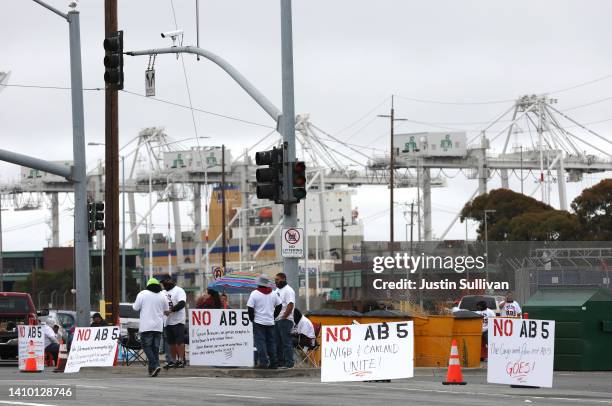 Truck drivers block the entrance to a container terminal at the Port of Oakland on July 21, 2022 in Oakland, California. Truckers protesting...