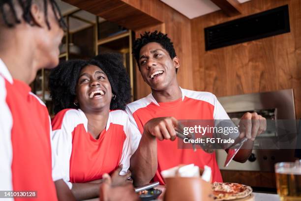 sports fan friends on a happy hour at a house - barbeque world championship stock pictures, royalty-free photos & images