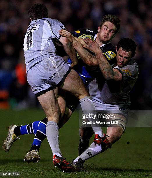 Tom Heathcote of Bath is tackled during the LV= Cup Semi Final match between Bath and Leicester Tigers at Recreation Ground on March 9, 2012 in Bath,...