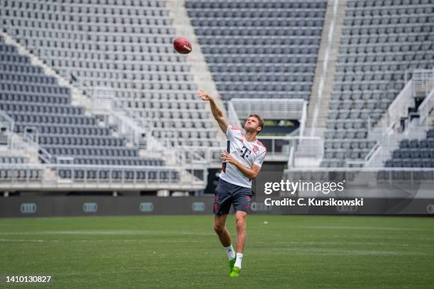 Thomas Mueller of FC Bayern Muenchen throwing a football during a training session of FC Bayern München on their "Audi Summer Tour" on July 21, 2022...