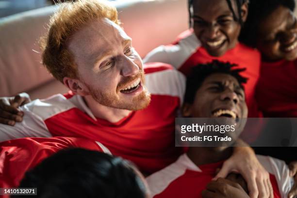 sports friends fans watching a match and celebrating at a house - man cry touching stock pictures, royalty-free photos & images