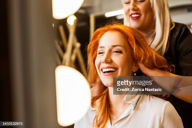 smiling woman at hairdresser - cute blonde women 個照片及圖片檔