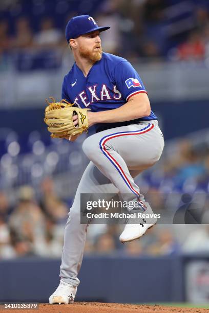 Jon Gray of the Texas Rangers delivers a pitch during the first inning against the Miami Marlins at loanDepot park on July 21, 2022 in Miami, Florida.