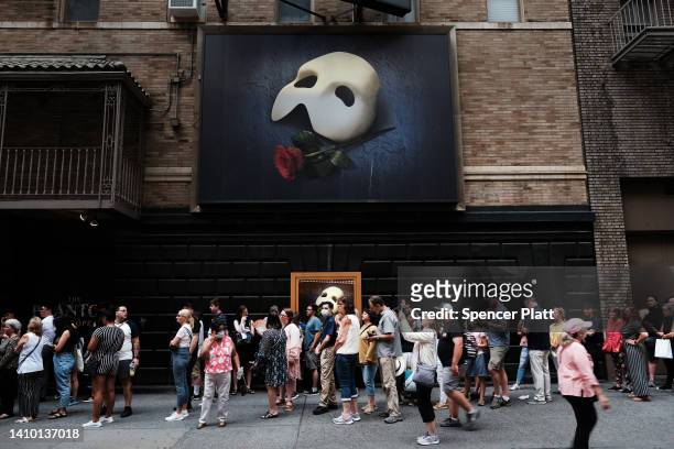 People wait in line to see Phantom of the Opera in midtown Manhattan as temperatures reach into the 90s on July 21, 2022 in New York City. Much of...