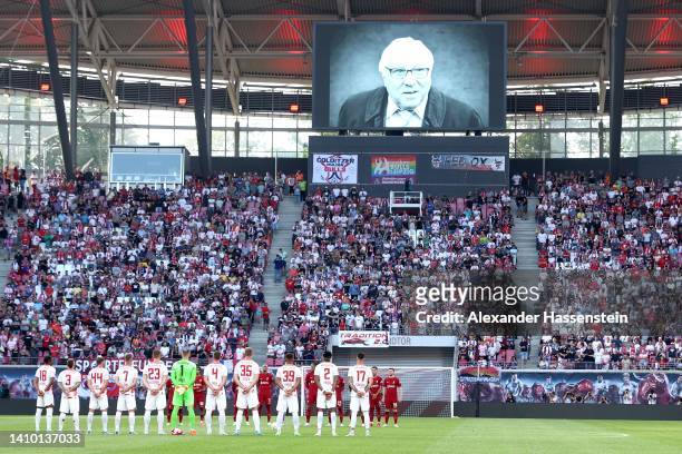 Players, officials and fans observe a minutes silence in memory of former German national player Uwe Seeler prior to the pre-season friendly match...