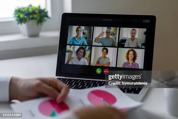 colleagues have online team meeting on laptop - employee engagement remote stock pictures, royalty-free photos & images