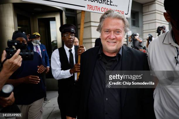 Former White House Chief Strategist Steve Bannon is escorted by private security as he leaves the Federal District Court House at the end of the...