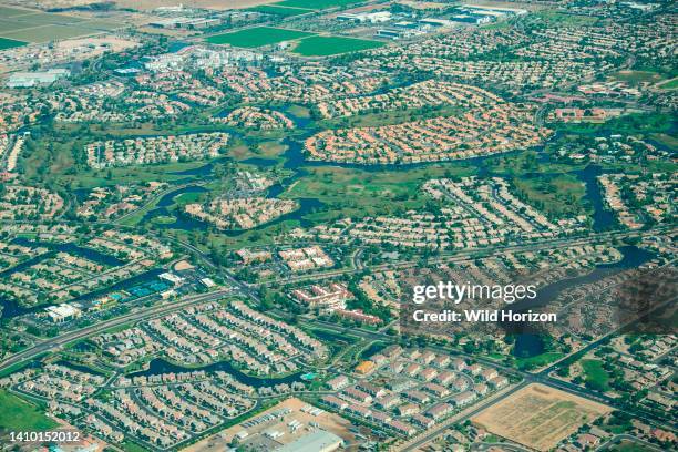 Aerial view of suburban development named Ocotillo in Chandler, Arizona, featuring a Florida lifestyle in the Sonoran Desert, with man-made lakes,...