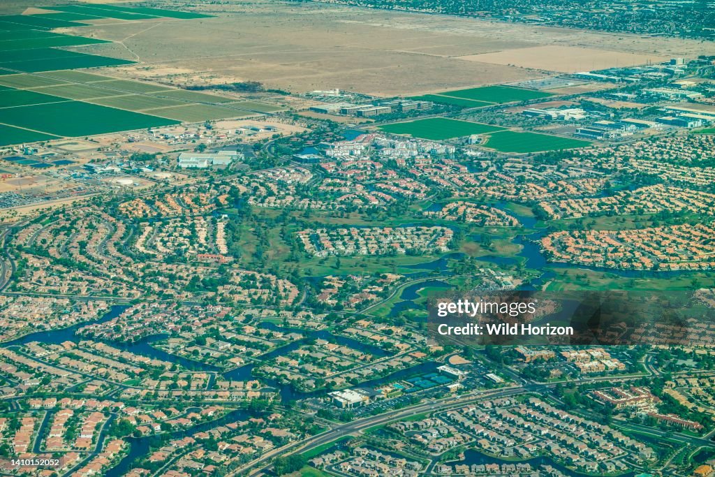 Aerial view of suburban development named Ocotillo featuring a Florida lifestyle in the Sonoran Desert with Gila River Indian Reservation in Chandler, Arizona