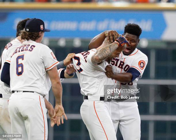 Matijevic of the Houston Astros celebrates with his teammates after hitting a walk-off single against the New York Yankees during game one of a...