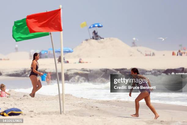 Flags direct swimmers to the safest areas on Long Beach July 21, 2022 in Long Beach, New York. A number of beaches have been closed or restricted...