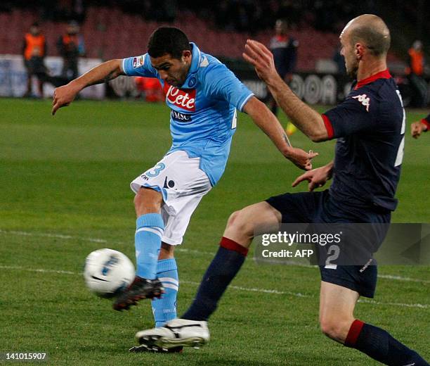Napoli's Uruguayan forward Walter Gargano scores as Cagliari's defender Italian Simone Gozzi tries to stop him during the Italian serie A football...