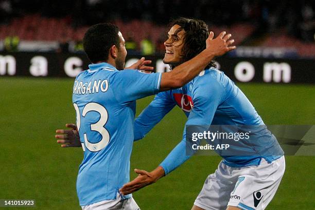 Napoli's Uruguayan forward Walter Gargano celebrates with teammate Uruguayan edinson Cavani during the Italian serie A football match between SSC...
