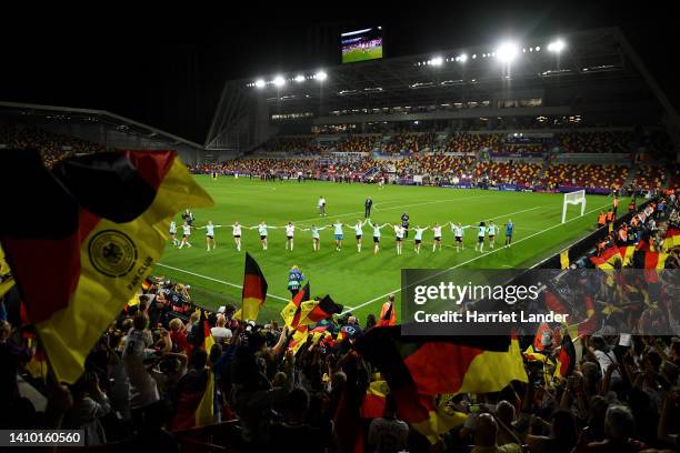 Germany players celebrate towards the fans following victory in the UEFA Women's Euro 2022 Quarter Final match between Germany and Austria at...