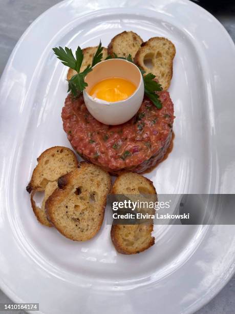 steak tartare and baguette slices - crostini stock pictures, royalty-free photos & images