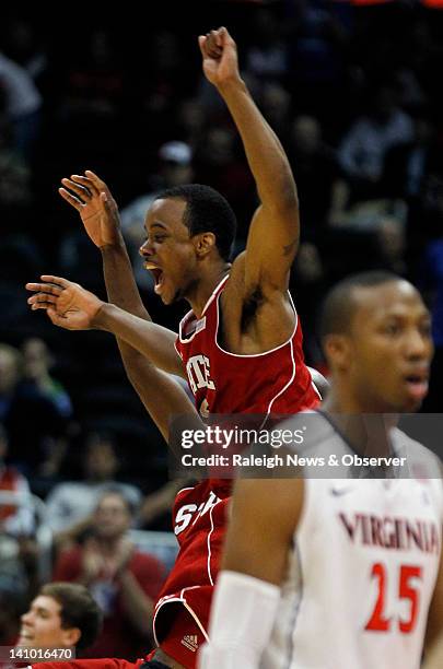 North Carolina State guard Lorenzo Brown celebrates as N.C. State beat Virginia 67-64 in the quarter-final round of the ACC tournament at Philips...