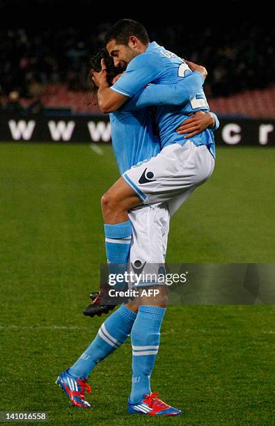 Napoli's Uruguayan forward Walter Gargano celebrates with teammate Uruguayan edinson Cavani during the Italian serie A football match between SSC...