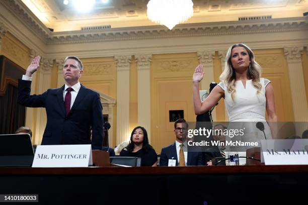 Former deputy national security adviser Matthew Pottinger and Sarah Matthews , former deputy White House press secretary, are sworn in before...