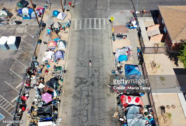 An aerial view of people gathered near a homeless encampment in the afternoon heat on July 21, 2022 in Phoenix, Arizona. The National Weather Service...