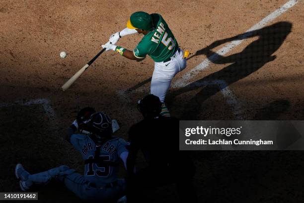 Tony Kemp of the Oakland Athletics hits an RBI single in the bottom of the sixth inning against the Detroit Tigers during game two of a doubleheader...