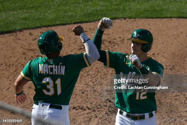 Sean Murphy of the Oakland Athletics celebrates with Vimael Machin after hitting a three-run home run in the bottom of the sixth inning against the...