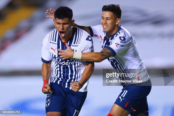 Jesus Gallardo of Monterrey celebrates with teammate Maximiliano Meza after scoring his team’s third goal during the 4th round match between...