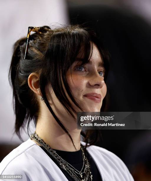 Billie Eilish attends a game between the San Francisco Giants and the Los Angeles Dodgers in the fifth inning at Dodger Stadium on July 21, 2022 in...